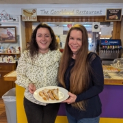 Clemence Nayral and Christine Fauver hold a plate of french toast in the goochland restaurant made from imported french bread